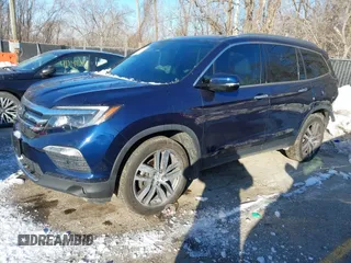 2017 Honda Pilot Touring with VIN 5FNYF6H99HB105446, listed as a IAAI auction lot 41283368 with 91,452 mi miles and . Bid and sale history available at DreamBid. Image 2.