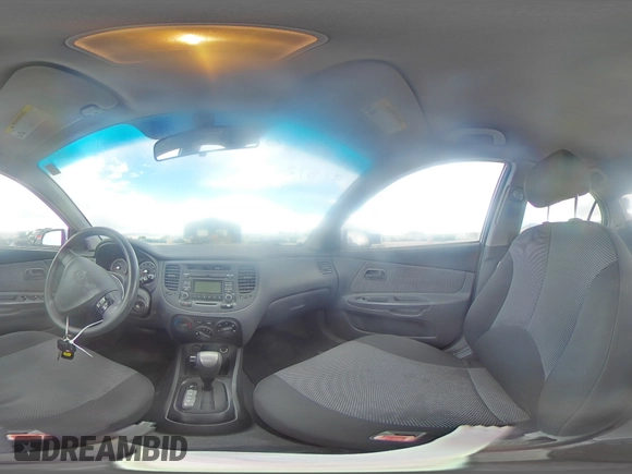 2009 Kia Rio LX with VIN KNADE223496469797, listed as a Copart auction lot 71005774 with 130,675 mi miles and Salvage Title. Bid and sale history available at DreamBid. Image 13.