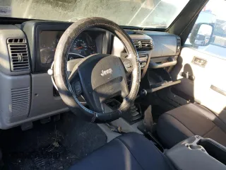 2004 Jeep Wrangler Rubicon with VIN 1J4FA69S94P778836, listed as a Copart auction lot 82884304 with 168,045 mi miles and Salvage Title. Bid and sale history available at carsss.com. Image 8.