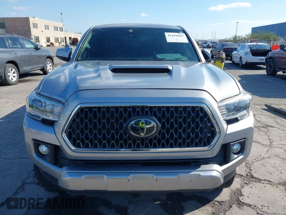 2018 Toyota Tacoma SR with VIN 3TMCZ5AN6JM185891, listed as a IAAI auction lot 41450665 with 53,749 mi miles and . Bid and sale history available at DreamBid. Image 13.