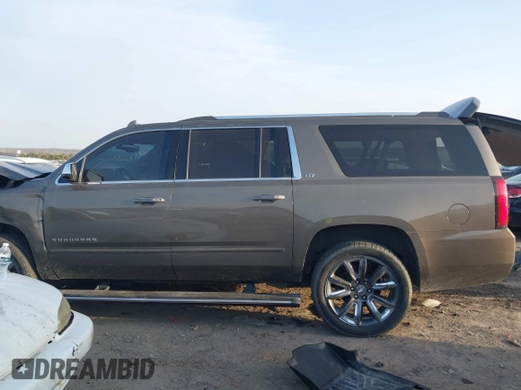 2015 Chevrolet Suburban LTZ with VIN 1GNSKKKC1FR628182, listed as a IAAI auction lot 41801391 with Not Provided miles and . Bid and sale history available at DreamBid. Image 14.