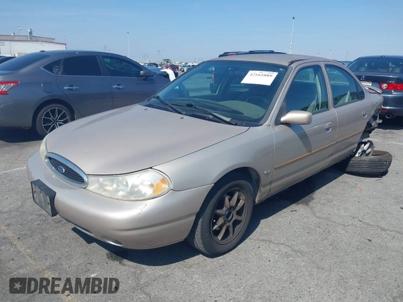 1999 Ford Contour z VIN 3FAFP66L6XM102099, wystawiony jako IAAI lot #42161889 z przebiegiem 100 340 mil mil oraz . Historia ofert i sprzedaży dostępna na DreamBid. Obrazek 2.