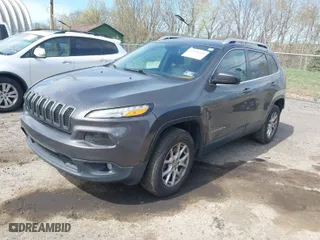 2014 Jeep Cherokee Latitude with VIN 1C4PJMCS8EW138499, listed as a IAAI auction lot 42098609 with 149,782 mi miles. Bid and sale history available at carsss.com. Image 2.