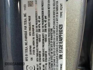 2023 Tesla Model 3 with VIN 5YJ3E1EA8PF692428, listed as a Copart auction lot 64667414 with 16,704 mi miles and Salvage Title. Bid and sale history available at DreamBid. Image 12.