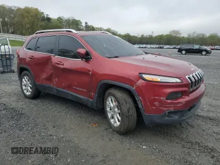 2014 Jeep Cherokee Altitude with VIN 1C4PJMCB7EW141684, listed as a Copart auction lot 51260065 with 163,656 mi miles and Salvage Title. Bid and sale history available at carsss.com. Image 4.