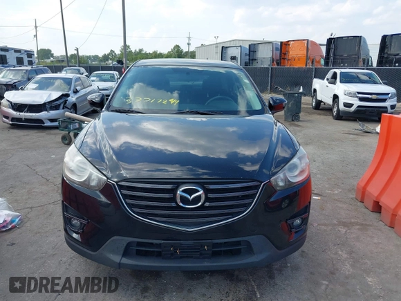 2016 Mazda CX-5 Touring with VIN JM3KE2CY5G0653108, listed as a IAAI auction lot 37717249 with 90,704 mi miles and . Bid and sale history available at DreamBid. Image 13.