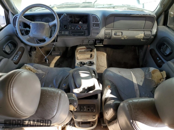 1999 GMC Denali z VIN 1GKEK13R0XR916686, wystawiony jako Copart lot #61120914 z przebiegiem 240 605 mil mil oraz Szkody całkowita. Historia ofert i sprzedaży dostępna na DreamBid. Obrazek 8.