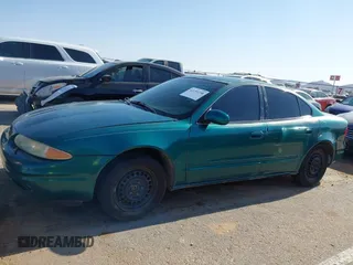 1999 Oldsmobile Alero GL z VIN 1G3NL52T0XC354966, wystawiony jako IAAI lot #42259258 z przebiegiem Nie podano mil oraz . Historia ofert i sprzedaży dostępna na DreamBid. Obrazek 14.