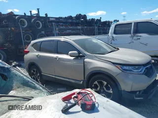 2018 Honda CR-V Touring with VIN 5J6RW1H98JL000031, listed as a IAAI auction lot 40605651 with 129,516 mi miles and . Bid and sale history available at DreamBid. Image 12.