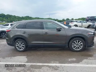 2017 Mazda CX-9 Touring z VIN JM3TCACY7H0129335, wystawiony jako IAAI lot #42289926 z przebiegiem 60 425 mil mil oraz . Historia ofert i sprzedaży dostępna na DreamBid. Obrazek 14.