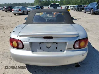 1999 Mazda MX-5 Miata z VIN JM1NB3538X0112611, wystawiony jako Copart lot #54732095 z przebiegiem 173 763 mil mil oraz Szkoda całkowita • Salvage title. Historia ofert i sprzedaży dostępna na DreamBid. Obrazek 6.
