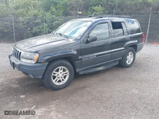 2003 Jeep Grand Cherokee Laredo with VIN 1J8GW48S63C596866, listed as a IAAI auction lot 42060430 with 129,849 mi miles. Bid and sale history available at carsss.com. Image 2.