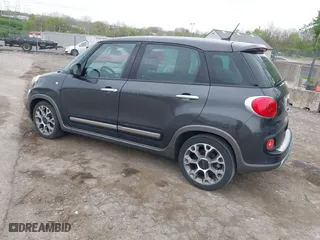 2014 FIAT 500L Trekking with VIN ZFBCFADHXEZ011031, listed as a IAAI auction lot 42094509 with 74,132 mi miles. Bid and sale history available at carsss.com. Image 3.