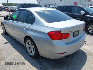 2013 BMW 3 Series 328i xDrive with VIN WBA3B3C52DJ975970, listed as a IAAI auction lot 42280624 with 2,262,225 mi miles and . Bid and sale history available at DreamBid. Image 3.