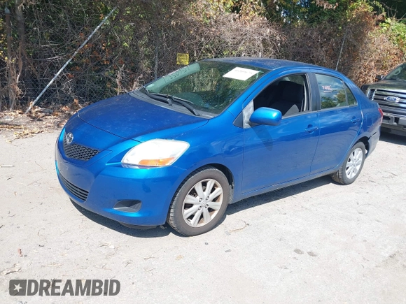 2009 Toyota Yaris with VIN JTDBT903091345311, listed as a IAAI auction lot 40269675 with 156,874 mi miles. Bid and sale history available at carsss.com. Image 2.