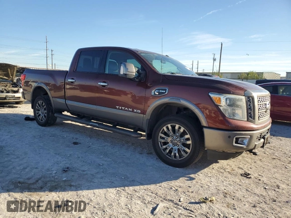2016 Nissan Titan Platinum Reserve z VIN 1N6BA1F2XGN506885, wystawiony jako Copart lot #80171524 z przebiegiem 318 311 mil mil oraz Czysty tytuł • Clean title. Historia ofert i sprzedaży dostępna na DreamBid. Obrazek 4.