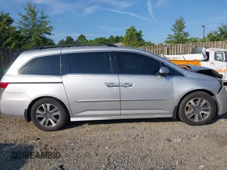 2014 Honda Odyssey Touring with VIN 5FNRL5H95EB108427, listed as a IAAI auction lot 39992643 with 100,658 mi miles and . Bid and sale history available at DreamBid. Image 13.