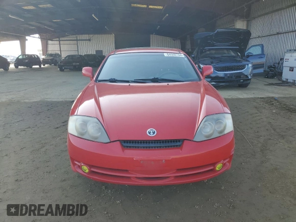 2003 Hyundai Tiburon GT z VIN KMHHN65F63U060104, wystawiony jako Copart lot #84560184 z przebiegiem 160 120 mil mil oraz Czysty tytuł • Clean title. Historia ofert i sprzedaży dostępna na DreamBid. Obrazek 5.
