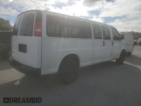 2014 Chevrolet Express Passenger 1LS with VIN 1GAZGZFAXE1105162, listed as a Copart auction lot 72773154 with 97,950 mi miles and Salvage title. Bid and sale history available at DreamBid. Image 3.