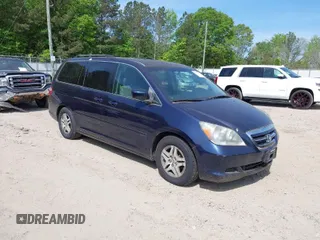 2007 Honda Odyssey EX with VIN 5FNRL38407B010983, listed as a IAAI auction lot 42083478 with 143,700 mi miles. Bid and sale history available at carsss.com. Image 1.