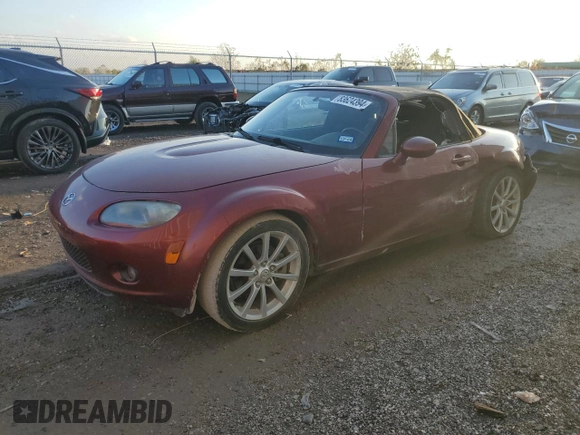 2007 Mazda MX-5 Miata Sport z VIN JM1NC25F970124896, wystawiony jako Copart lot #83624394 z przebiegiem 62 735 mil mil oraz Szkoda całkowita • Salvage title. Historia ofert i sprzedaży dostępna na DreamBid. Obrazek 1.