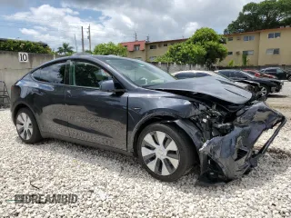 2024 Tesla Model Y with VIN 7SAYGDED2RF040079, listed as a Copart auction lot 57237054 with 2,549 mi miles and Non Repairable. Bid and sale history available at DreamBid. Image 4.