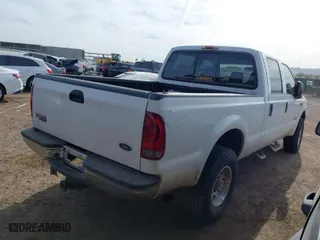 2004 Ford Super Duty F-250 XL with VIN 1FTNW21P54EC54548, listed as a IAAI auction lot 41722979 with 214,043 mi miles. Bid and sale history available at carsss.com. Image 4.