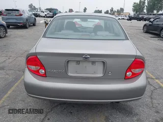 2000 Nissan Maxima GXE z VIN JN1CA31D0YT754624, wystawiony jako IAAI lot #42299290 z przebiegiem 81 958 mil mil oraz . Historia ofert i sprzedaży dostępna na DreamBid. Obrazek 16.