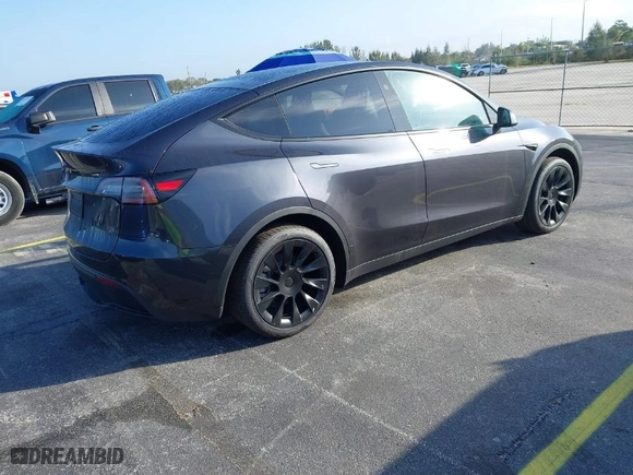 2024 Tesla Model Y with VIN 7SAYGDED4RF097142, listed as a IAAI auction lot 41484729 with 20 mi miles. Bid and sale history available at carsss.com. Image 4.