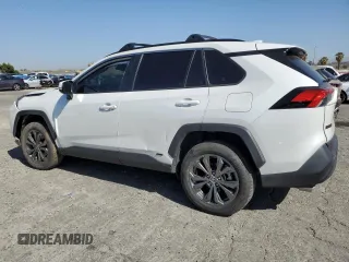2024 Toyota RAV4 Hybrid XLE Premium with VIN JTMB6RFV6RD120633, listed as a Copart auction lot 57620825 with 28,817 mi miles and Salvage title. Bid and sale history available at DreamBid. Image 2.