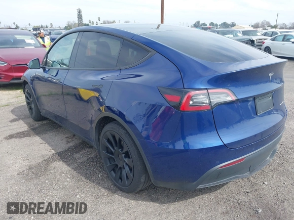 2021 Tesla Model Y Long Range with VIN 5YJYGAEE5MF199286, listed as a IAAI auction lot 41677915 with 52,500 mi miles. Bid and sale history available at carsss.com. Image 3.