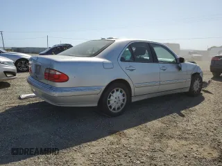 2000 Mercedes-Benz E-Class with VIN WDBJF65J4YB159268, listed as a Copart auction lot 50923115 with 127,650 mi miles and Salvage Title. Bid and sale history available at carsss.com. Image 3.