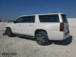 2018 Chevrolet Suburban Premier with VIN 1GNSCJKC9JR355511, listed as a Copart auction lot 75435744 with 79,192 mi miles and Salvage Title. Bid and sale history available at carsss.com. Image 2.