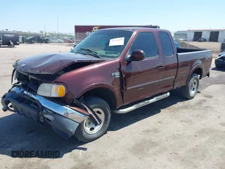 2000 Ford F-150 XL with VIN 1FTRX18L5YNA99713, listed as a IAAI auction lot 42194838 with Not provided miles and . Bid and sale history available at DreamBid. Image 2.