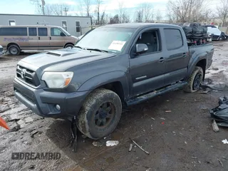2014 Toyota Tacoma with VIN 3TMLU4EN0EM148389, listed as a IAAI auction lot 41490721 with 119,731 mi miles. Bid and sale history available at carsss.com. Image 2.