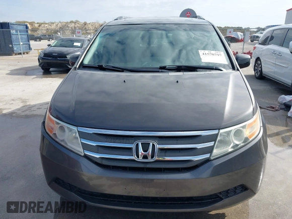 2012 Honda Odyssey EX-L with VIN 5FNRL5H60CB094682, listed as a IAAI auction lot 41570797 with 127,890 mi miles and . Bid and sale history available at carsss.com. Image 12.