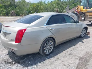 2014 Cadillac CTS Luxury RWD z VIN 1G6AR5SX4E0141195, wystawiony jako IAAI lot #42144565 z przebiegiem 80 267 mil mil oraz . Historia ofert i sprzedaży dostępna na DreamBid. Obrazek 4.