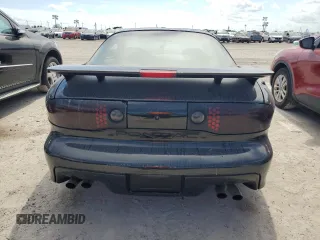 2000 Pontiac Firebird Formula z VIN 2G2FV22G9Y2140113, wystawiony jako Copart lot #76135324 z przebiegiem Nie podano mil oraz Szkody całkowita. Historia ofert i sprzedaży dostępna na DreamBid. Obrazek 6.
