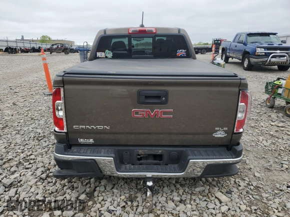 2016 GMC Canyon 4WD SLE z VIN 1GTG6CE38G1303839, wystawiony jako Copart lot #57387295 z przebiegiem 87 945 mil mil oraz Nie do naprawy. Historia ofert i sprzedaży dostępna na DreamBid. Obrazek 6.