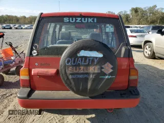 1998 Suzuki Sidekick JS z VIN 2S3TE02V3W6406072, wystawiony jako Copart lot #75855544 z przebiegiem 120 359 mil mil oraz Szkody całkowita. Historia ofert i sprzedaży dostępna na DreamBid. Obrazek 6.