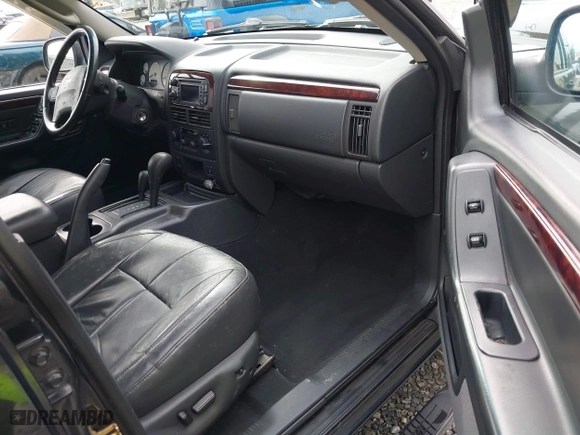 2004 Jeep Grand Cherokee Limited with VIN 1J8GW58N04C186548, listed as a IAAI auction lot 41949015 with 244,505 mi miles. Bid and sale history available at carsss.com. Image 5.