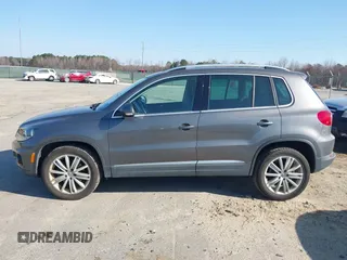 2012 Volkswagen Tiguan SE with VIN WVGAV7AX5CW000275, listed as a IAAI auction lot 41789246 with 123,618 mi miles and . Bid and sale history available at DreamBid. Image 14.