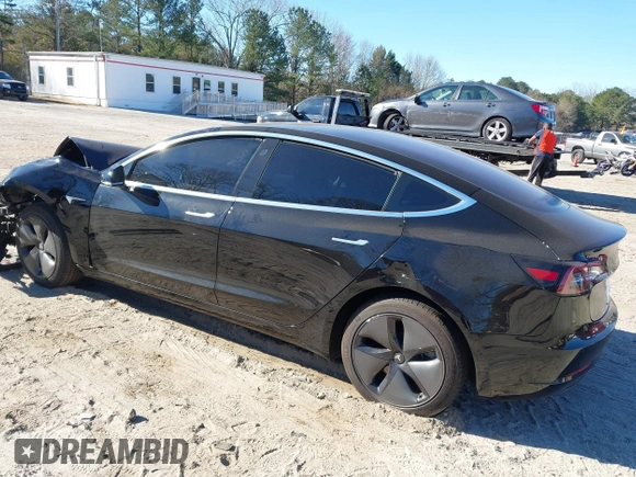 2019 Tesla Model 3 Mid Range with VIN 5YJ3E1EA2KF306286, listed as a IAAI auction lot 41699127 with 56,249 mi miles and . Bid and sale history available at DreamBid. Image 3.