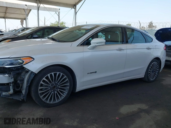 2017 Ford Fusion Hybrid Titanium with VIN 3FA6P0RU8HR229653, listed as a IAAI auction lot 42445182 with 163,279 mi miles and . Bid and sale history available at DreamBid. Image 14.
