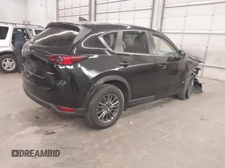 2020 Mazda CX-5 Touring with VIN JM3KFBCM9L1785125, listed as a IAAI auction lot 41983561 with 101,062 mi miles and . Bid and sale history available at carsss.com. Image 4.