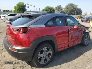 2022 Mazda MX-30 Premium Plus Package with VIN JM1DRADB7N0100256, listed as a Copart auction lot 69304084 with 11,057 mi miles and Salvage Title. Bid and sale history available at carsss.com. Image 3.