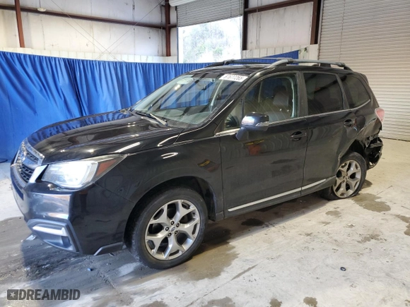2017 Subaru Forester Touring with VIN JF2SJAWC8HH564037, listed as a Copart auction lot 87677265 with 114,986 mi miles and Salvage Title. Bid and sale history available at carsss.com. Image 1.