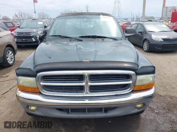 2001 Dodge Dakota Sport z VIN 1B7HG2ANX1S256902, wystawiony jako IAAI lot #42037703 z przebiegiem 121 914 mil mil oraz . Historia ofert i sprzedaży dostępna na DreamBid. Obrazek 12.