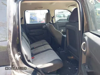 2009 Dodge Nitro SE z VIN 1D8GT28K69W505396, wystawiony jako IAAI lot #42104252 z przebiegiem 144 026 mil mil oraz . Historia ofert i sprzedaży dostępna na DreamBid. Obrazek 8.