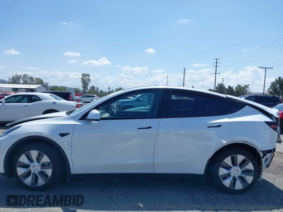 2023 Tesla Model Y Long Range with VIN 7SAYGAEE5PF855834, listed as a IAAI auction lot 41943491 with 34,480 mi miles. Bid and sale history available at carsss.com. Image 20.